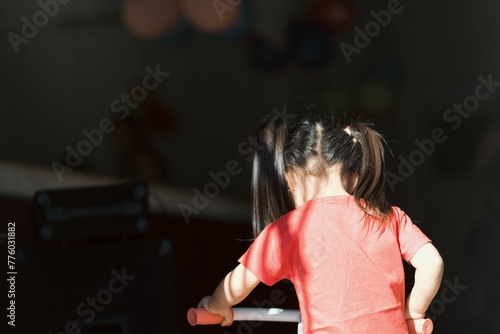 Closeup view of a little girl from backward