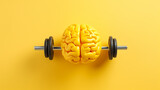 Top view of yellow rasin human Brain, lifting dumpbell on bright yellow background. Brain work out/excercise Concept.