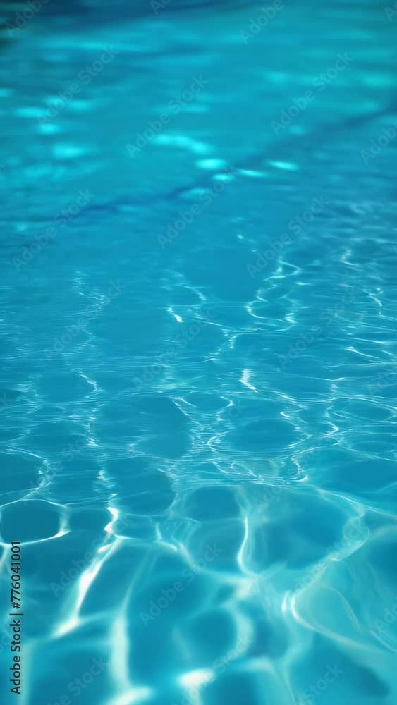 Close view of clear beautiful blue flowing water in swimming pool. Slow motion vertical video. Water surface. Travel and vacation concept. Summer Close view of clear beautiful blue flowing water in swimming pool. Slow motion vertical video. Water surface. Travel and vacation concept. Summer