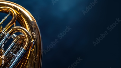 Part of tuba with navy blue background with copy space photo