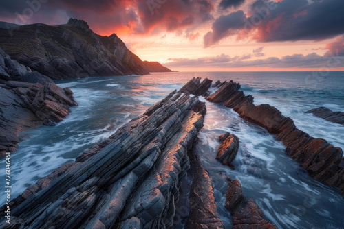 A beautiful seascape with a unique rock structure during the sunrise #776046451