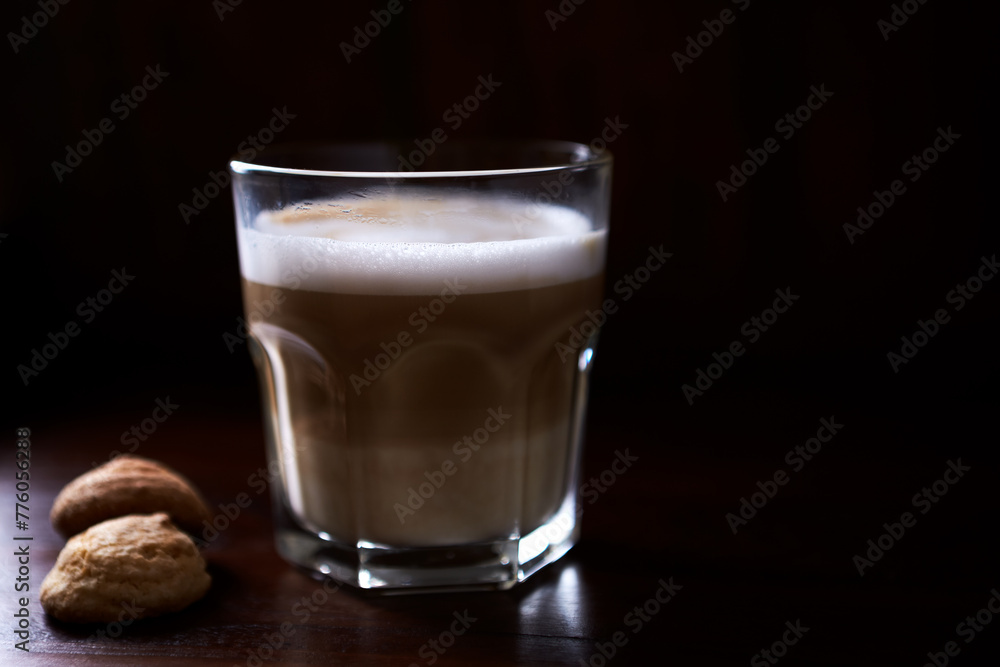 Coffee with milk on rustic wooden background. Soft focus. Close up. Copy space. Coffee with milk on rustic wooden background. Soft focus. Close up. Copy space.