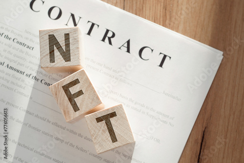 text NFT on wooden blocks with letters on a white background