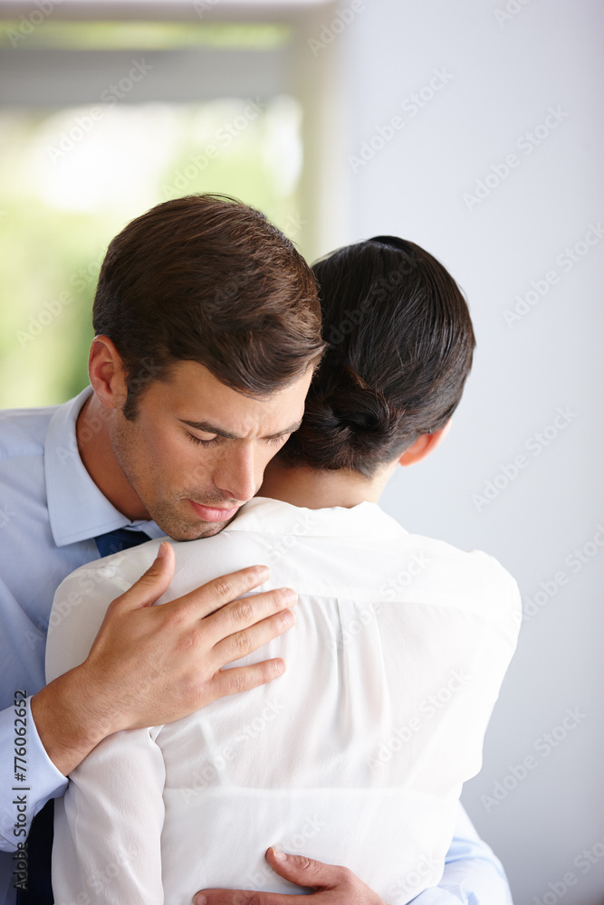 Businessman hug woman for comfort, support and relief at company office. Sad employee and manager help with grief, anxiety and work stress for depression or mental health at professional workplace Businessman hug woman for comfort, support and relief at company office. Sad employee and manager help with grief, anxiety and work stress for depression or mental health at professional workplace