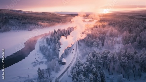 aerial view of a cold sunrise over a misty snow-covered landscape © pier