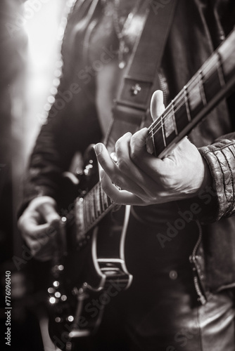 black and white photo, blurry photo. bokeh, guitar, music, guitarist, rock, metal, stage