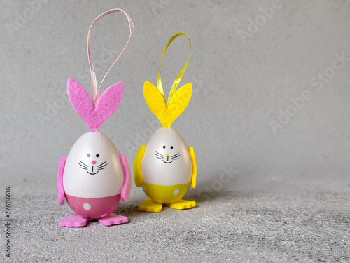 Funny egg bunnies, cute Easter decor.  Two funny Easter eggs with cartoon bunny faces. 