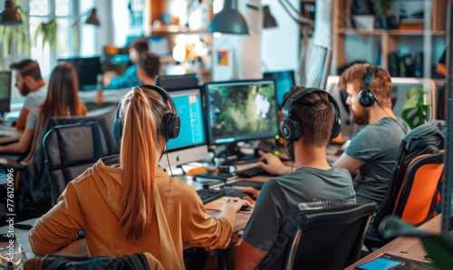 A cohesive team of game developers collaborates in an office environment, pooling their creativity and expertise to craft innovative gaming experiences
