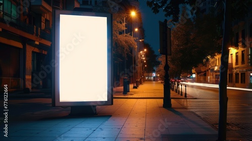 Blank white vertical advertising banner billboard at night