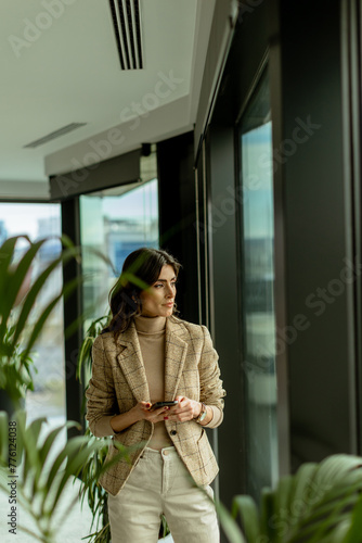 Elegant woman clad in chic ...