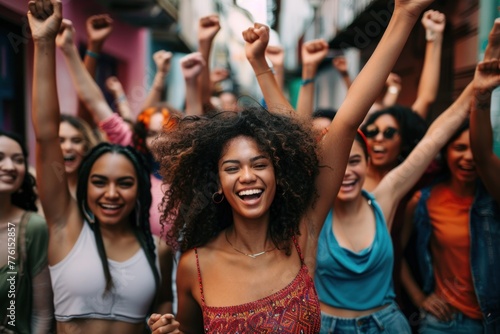 Large group of confident women celebrating in the streets photo
