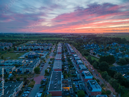 Sunset over the residential area in city Nijkerk, Netherlands. View from above. 