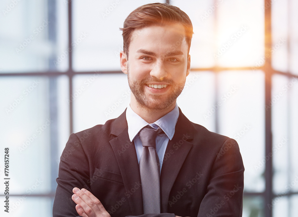 Portrait of a happy man wearing glasses and looking at the camera indoors. Portrait of a happy man wearing glasses and looking at the camera indoors.