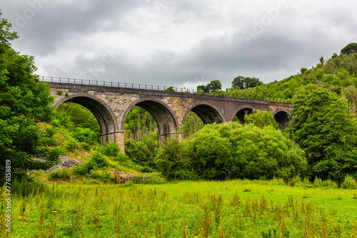 Monsal Head and Monsal Dale and the old railway viaduct over the river Wye in the Peak District in Derbyshire, England photo