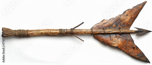   A tight shot of a wooden object with an arrow piercing its middle and a protruding piece of wood from its side