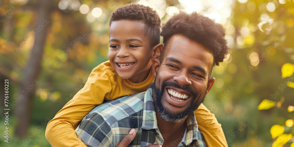 Portrait of loving father and his little son outdoors. Dad hugging his boy as a symbol of fatherly love. Good parenting, quality time with a child. Celebration of Father's Day concept. Portrait of loving father and his little son outdoors. Dad hugging his boy as a symbol of fatherly love. Good parenting, quality time with a child. Celebration of Father's Day concept.