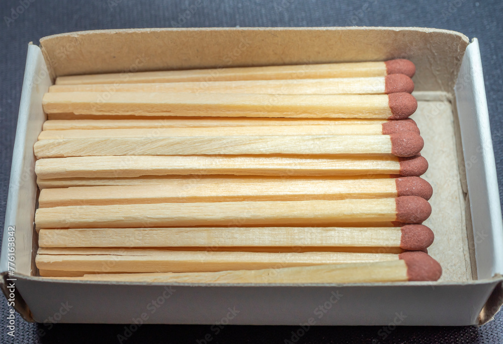 Wooden matches in a matchbox. Close-up
Wooden matches in a matchbox. Close-up