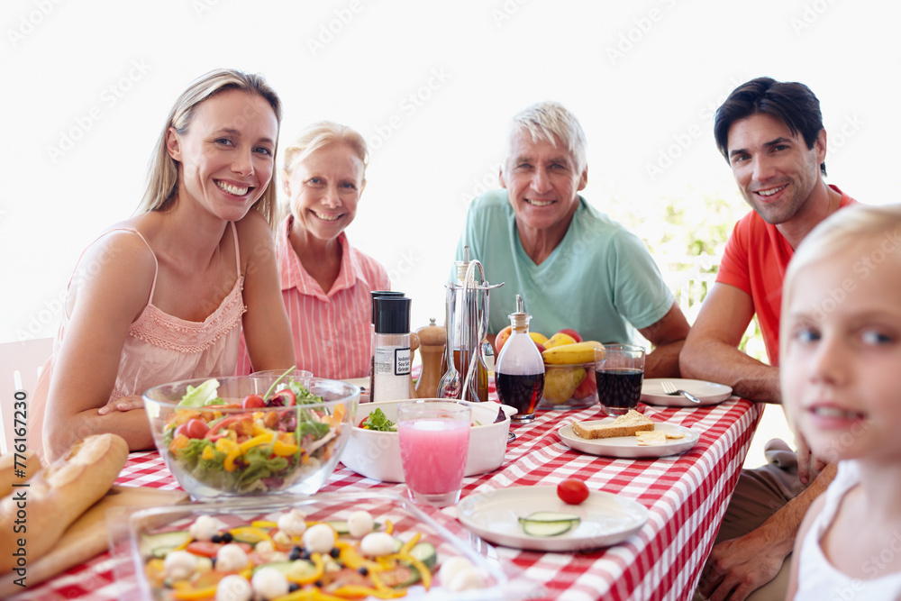 Portrait, family and young girl in living room at table with salad, vegetables and eating together for lunch. Mom, dad and child on vacation at childhood house visiting grandparents for memory