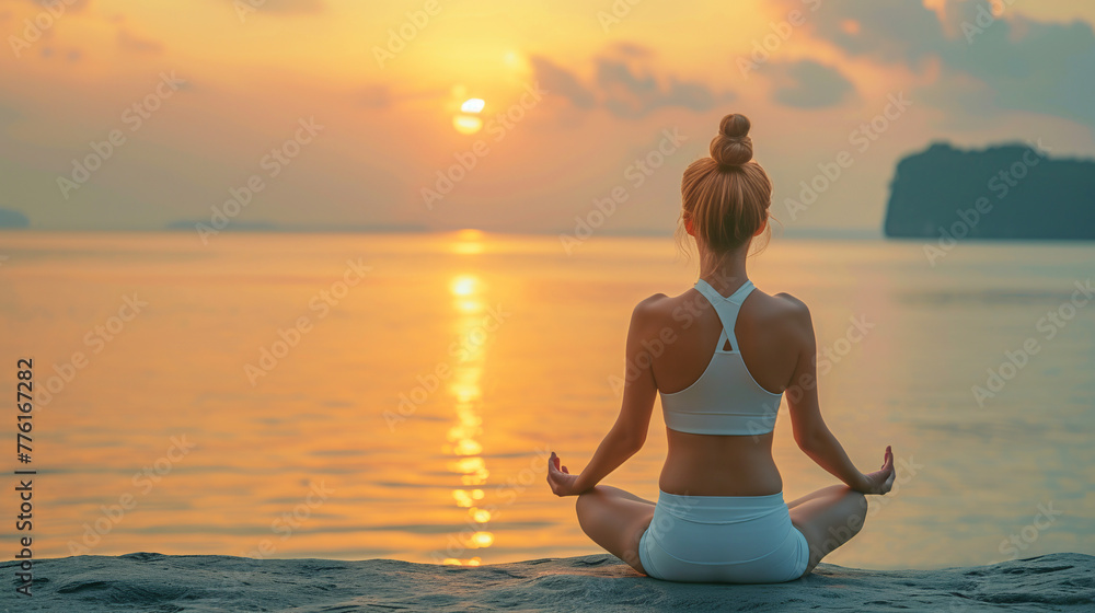 Woman practicing yoga, sitting in lotus position. Serenity, meditation, Zen. Yoga in nature. Yoga practice at sunset.