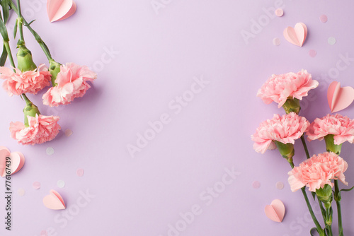Mother’s Day charm: A tender arrangement of pink carnations and delicate paper hearts on a pastel purple background, with space for loving messages