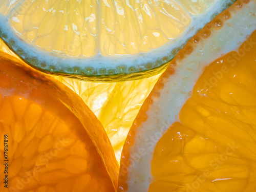Obraz na płótnie Close up of tropical citrus fruits slices - top view.