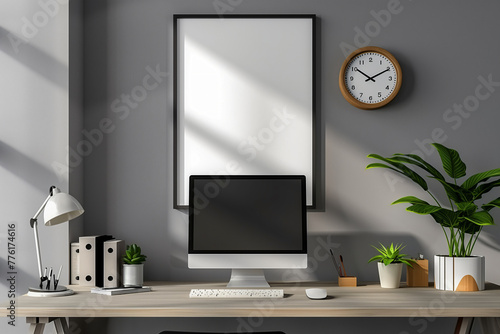 photo of an empty frame on the wall above desktop computer