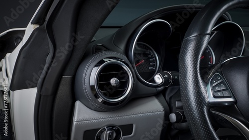 Black leather car steering wheel © The Image Engine