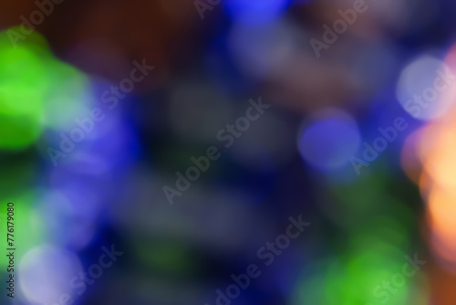Defocused neon glow. Overlaying highlights. Futuristic LED lighting. Blur of neon colors on dark background