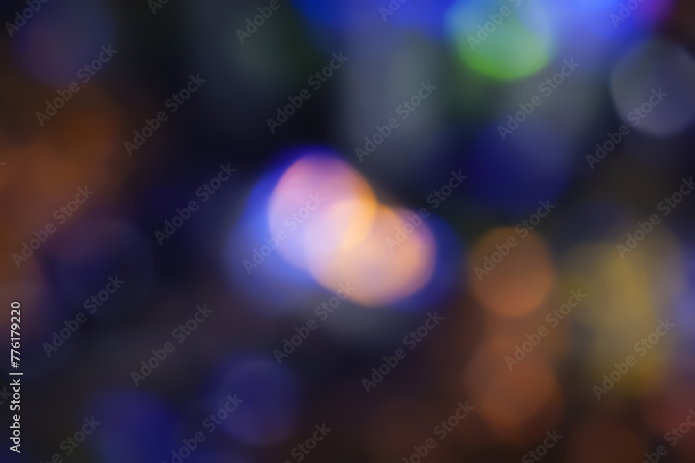 Defocused neon glow. Overlay of light highlights. Futuristic abstract LED backlight. Neon colors blur on dark background