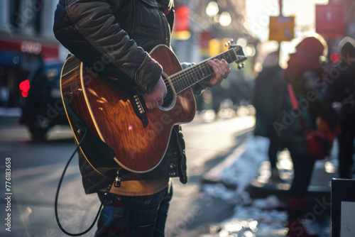 A photo of a lone street musician playing their guitar photo