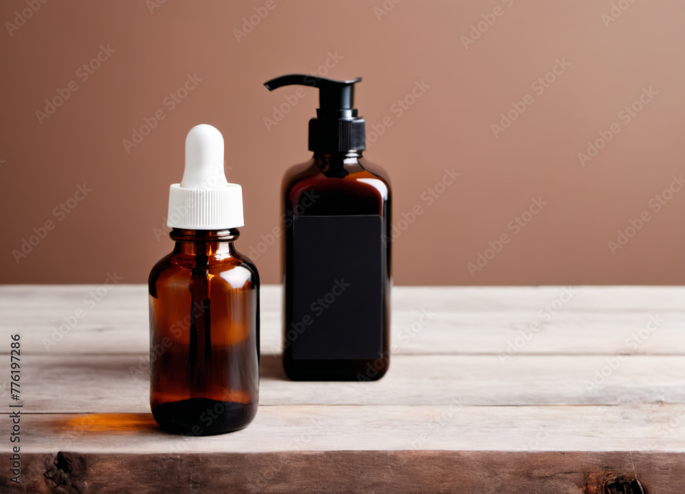 One cosmetic dark amber glass bottle with white lable on wooden table. Closeup