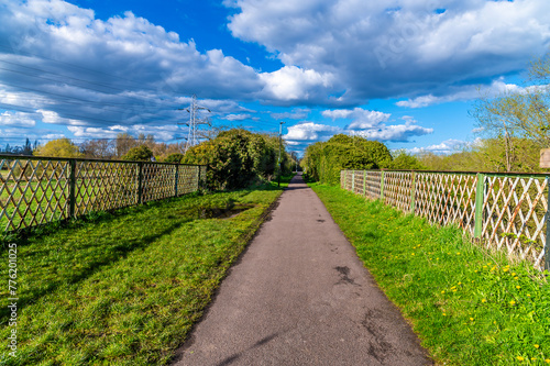 A view across the top of a disused old railway bridge over the Grand Union Canal in Aylestone Meadows, Leicester, UK in Springtime photo