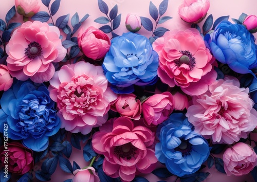 Bunch of pink and blue flowers arranged on a soft pink background