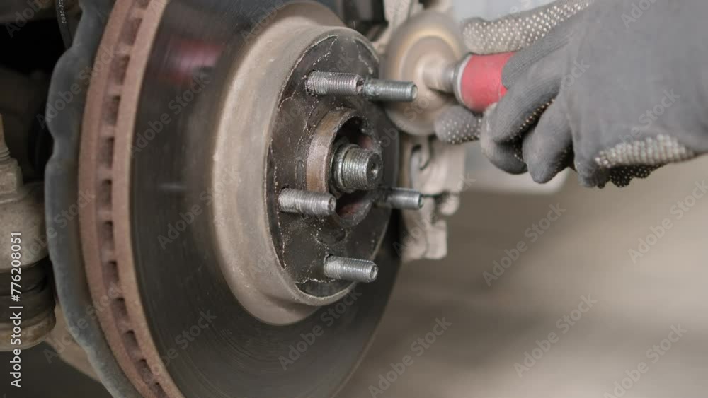 Repair of brake discs on a car. Grinding brake discs. Close-up. Repair of brake discs on a car. Grinding brake discs. Close-up.