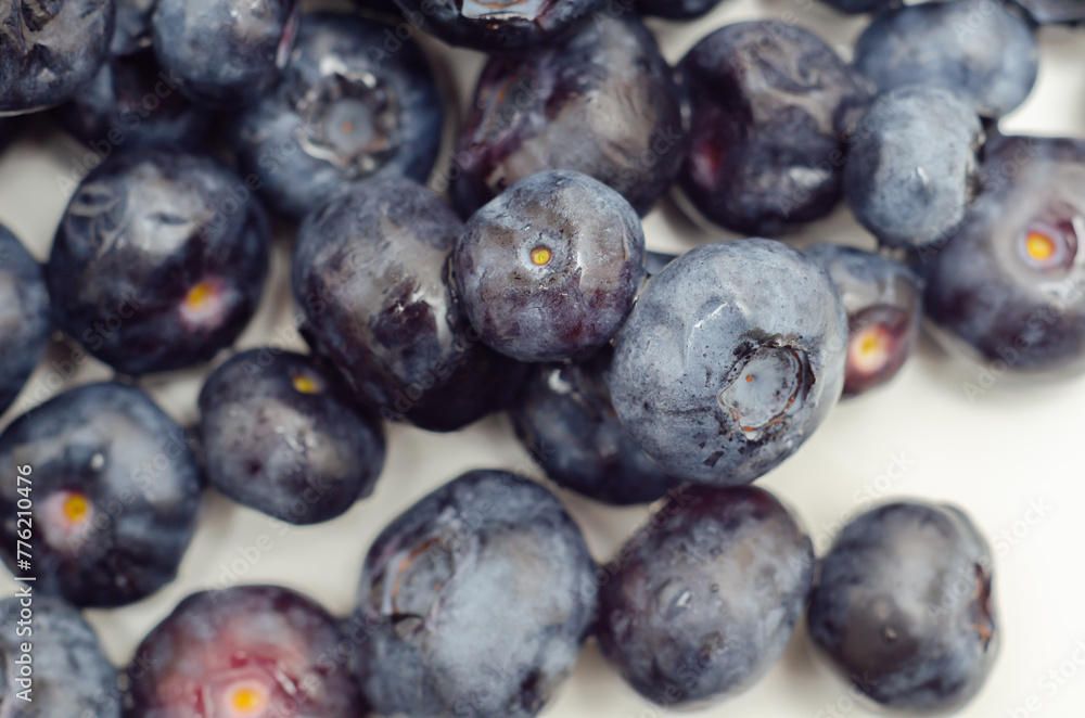Fototapeta premium A bunch of blueberries are shown in a close up