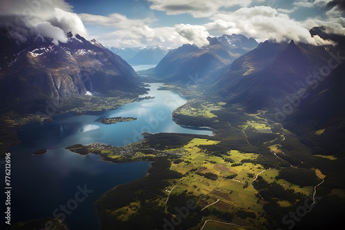 A beautiful river flowing between the mountains on a summer day, bird's eye view, clouds in the sky