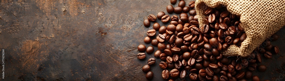 Spilled coffee beans from burlap sack showcase rich textures and colors with copy space Spilled coffee beans from burlap sack showcase rich textures and colors with copy space