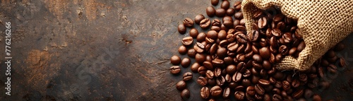 Spilled coffee beans from burlap sack showcase rich textures and colors with copy space photo