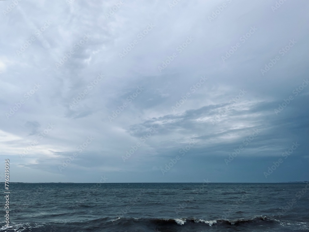 Dark cloudy seascape, cloudy sea horizon