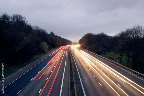 Aerial view of light trails along the M4 in Wiltshire, England at twilight