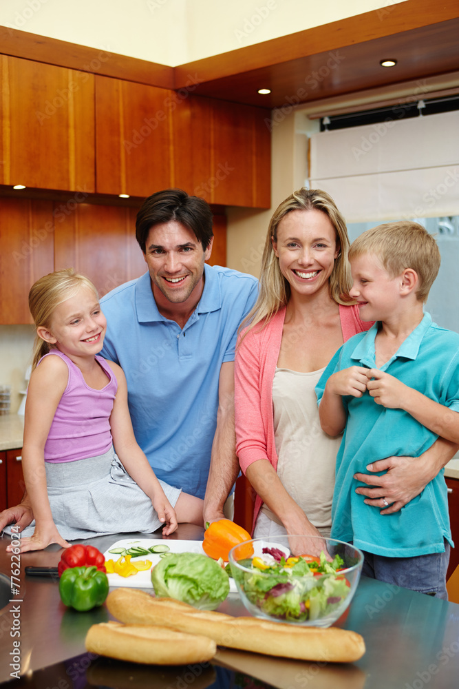 Happy family, healthy food and kitchen counter at house with smile for dinner, love and connection or togetherness. Male, female person and children at home and cooking with salad, diet or nutrition Happy family, healthy food and kitchen counter at house with smile for dinner, love and connection or togetherness. Male, female person and children at home and cooking with salad, diet or nutrition