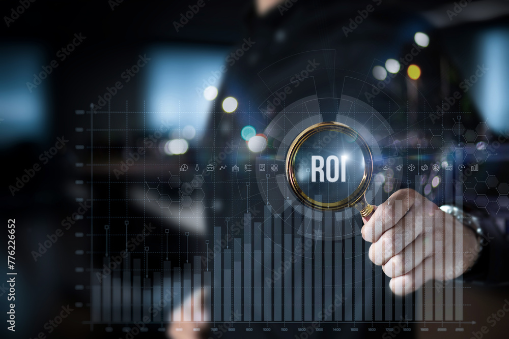 Fototapeta premium Investor analyzes return on investment on virtual screen.