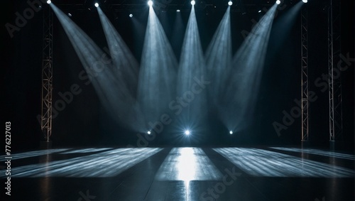 An empty stage bathed in dramatic lighting evoking anticipation and the performing arts photo