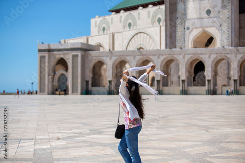 Joyful Woman With Scarf at Mosque Courtyard