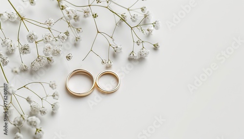 Two golden wedding rings with white roses on a gold background stock images. Engagement rings with a bouquet of white flowers image. AI generated illustration