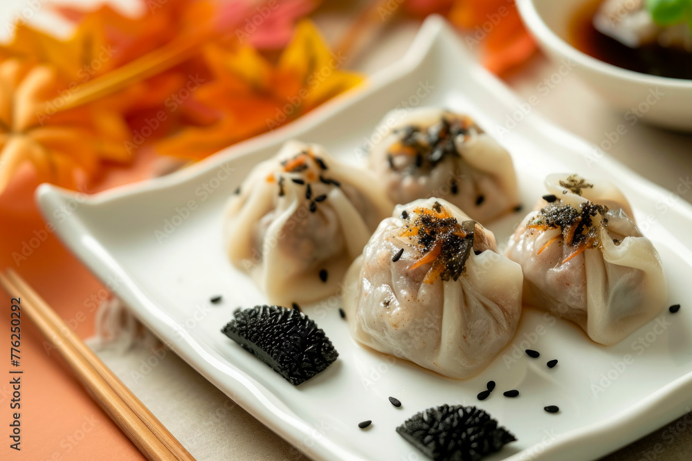 Three dumplings with sauce and garnish on a white plate Three dumplings with sauce and garnish on a white plate