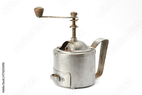 old manual coffee grinder isolated on white