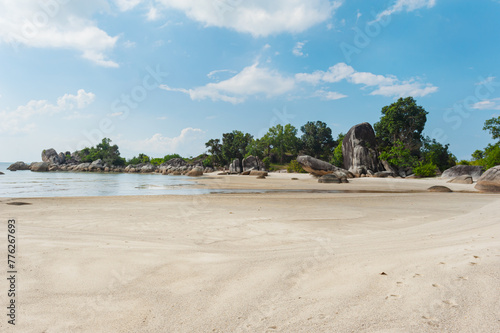 Fototapeta Naklejka Na Ścianę i Meble -  Beautiful beach with white sand with huge granite stones surrounded by greenery near Tanjung Tinggi, Belitung, Sumatra, Indonesia.
