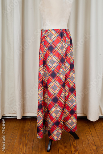 Long vintage maxi skirt with a vibrant 70s plaid pattern. 