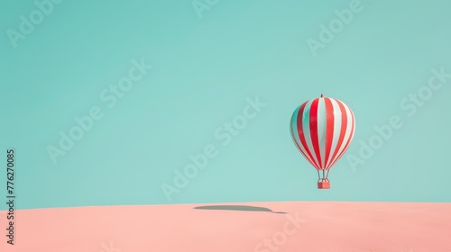  A red-and-white striped hot air balloon soars above a pink sand dune against a backdrop of a blue sky